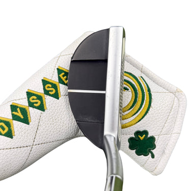 Mega Golf Odyssey Stroke Lab Nine putter, 34 inch, left hand. Black face with white alignment lines. White headcover with green and yellow Odyssey logo and shamrock.