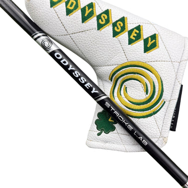 Mega Golf Odyssey Stroke Lab Nine putter with white headcover featuring green and yellow diamond pattern and clover detail.