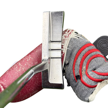 Mega Golf Odyssey White Ice #6 right-handed steel shaft putter with red grip and headcover. 34" length.