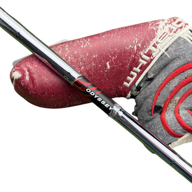 Mega Golf Odyssey White Ice #6 putter with a worn red headcover and grey fabric cover.