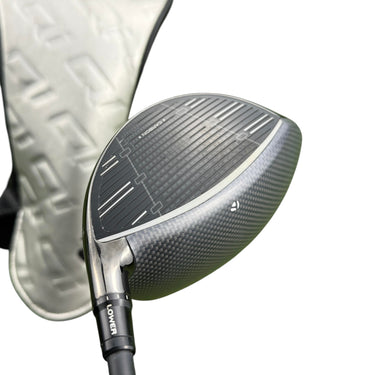 Mega Golf Taylormade Qi35 LS driver with 10.5° loft, graphite shaft, and black carbon fiber head.