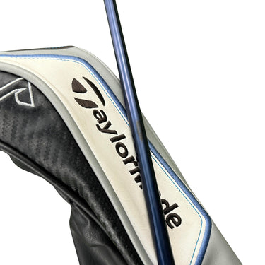 Mega Golf Taylormade Sim Max #3 wood with Ventus Blue graphite shaft and headcover on grass.