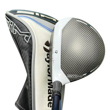 Mega Golf Taylormade Sim Max #3 wood with Ventus Blue graphite shaft and headcover on grass.